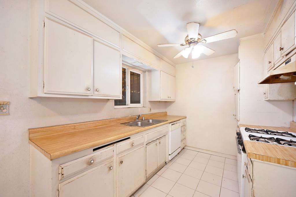 7580 Bellini Way Sacramento, CA 95828 - Photo 16 of 34 a kitchen with a sink and cabinets