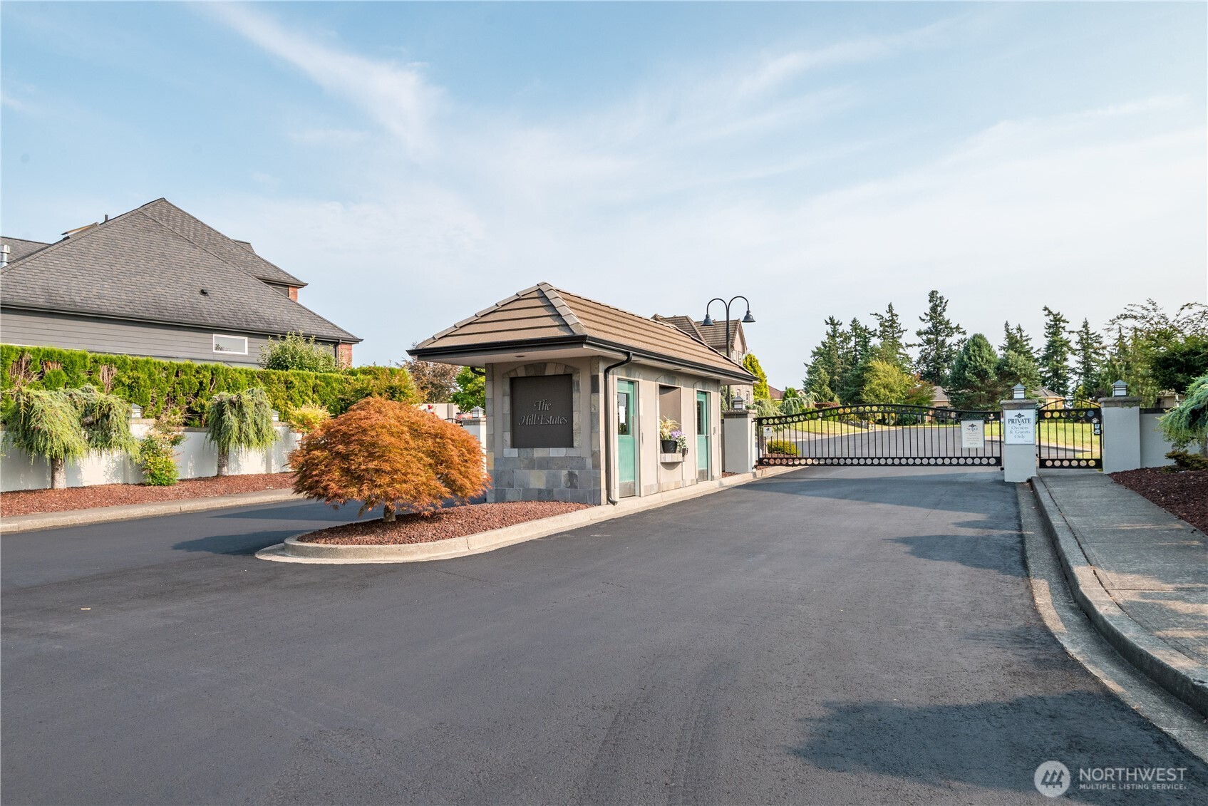 12 Forest Hill Estate Longview, WA 98632 - Photo 14 of 22 a white house with a large parking space and a car parked in front of it