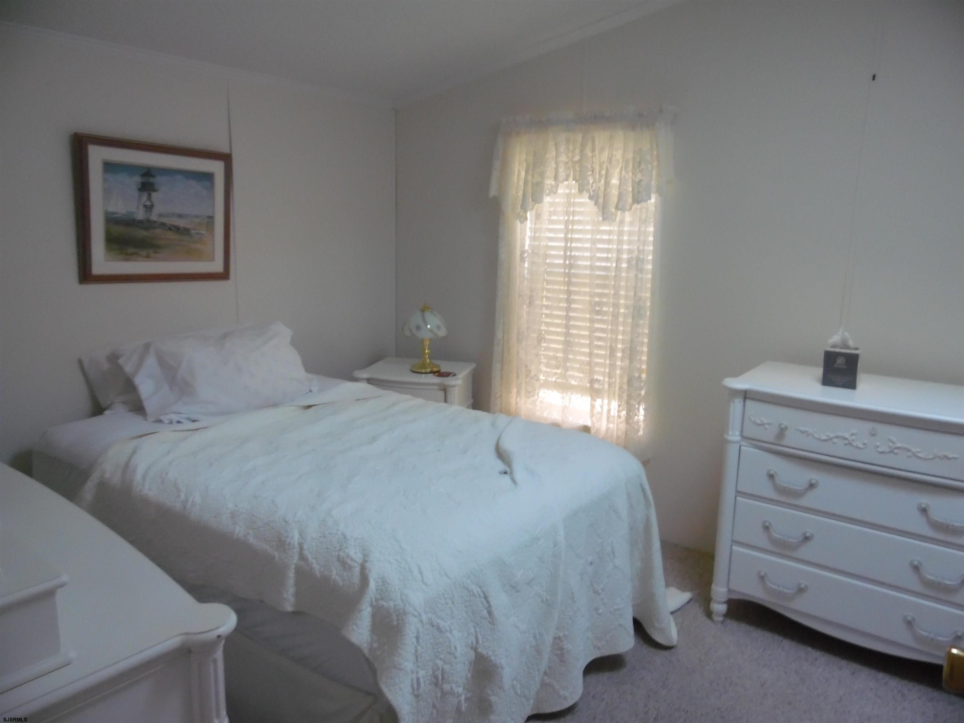 82 Elm Street Absecon, NJ 08205 - Photo 16 of 19 a bedroom with a bed and a window