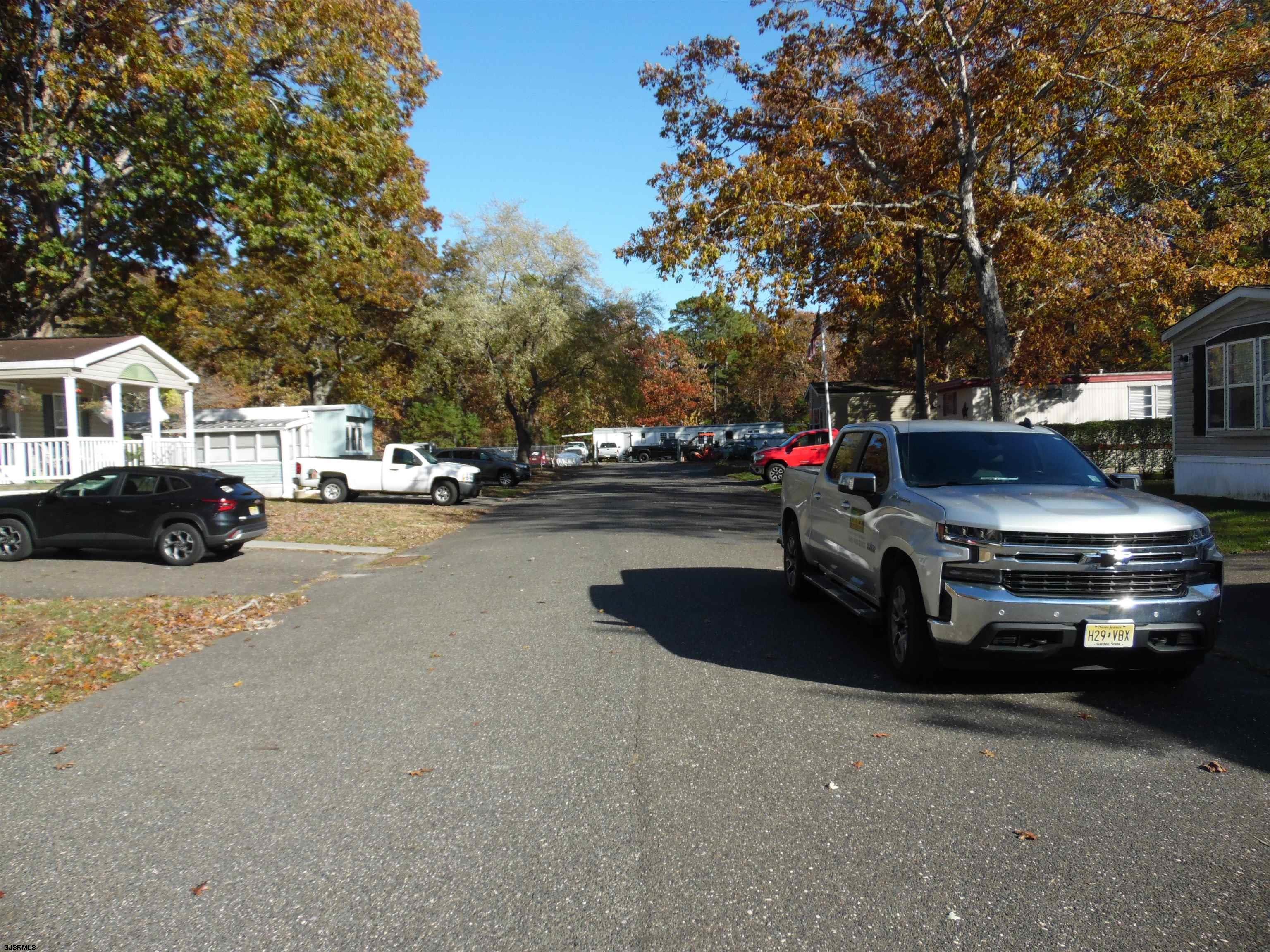 82 Elm Street Absecon, NJ 08205 - Photo 4 of 19 a view of street with parked cars