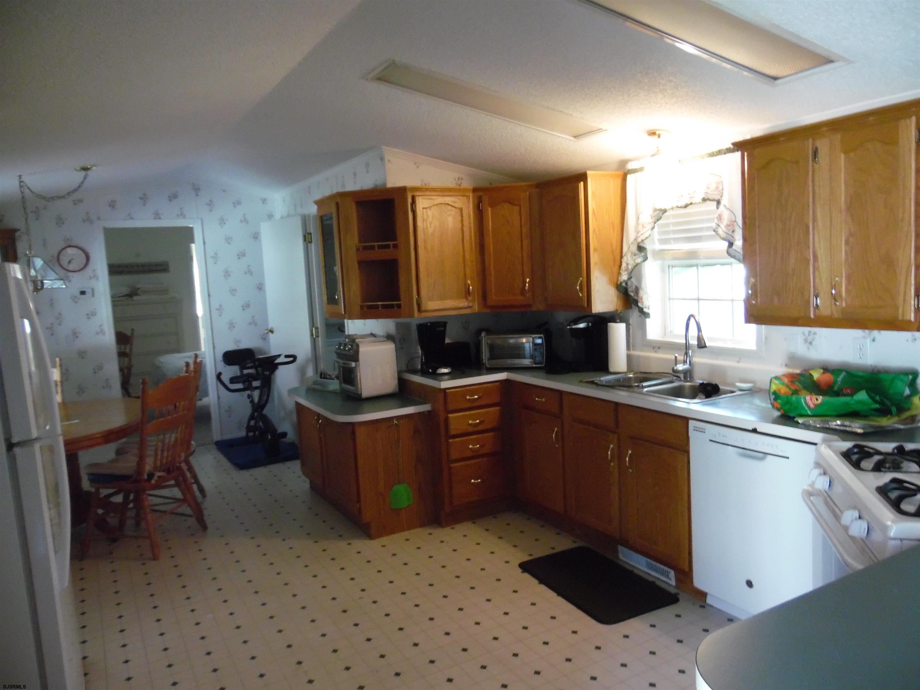 82 Elm Street Absecon, NJ 08205 - Photo 6 of 19 a kitchen with sink cabinets and window