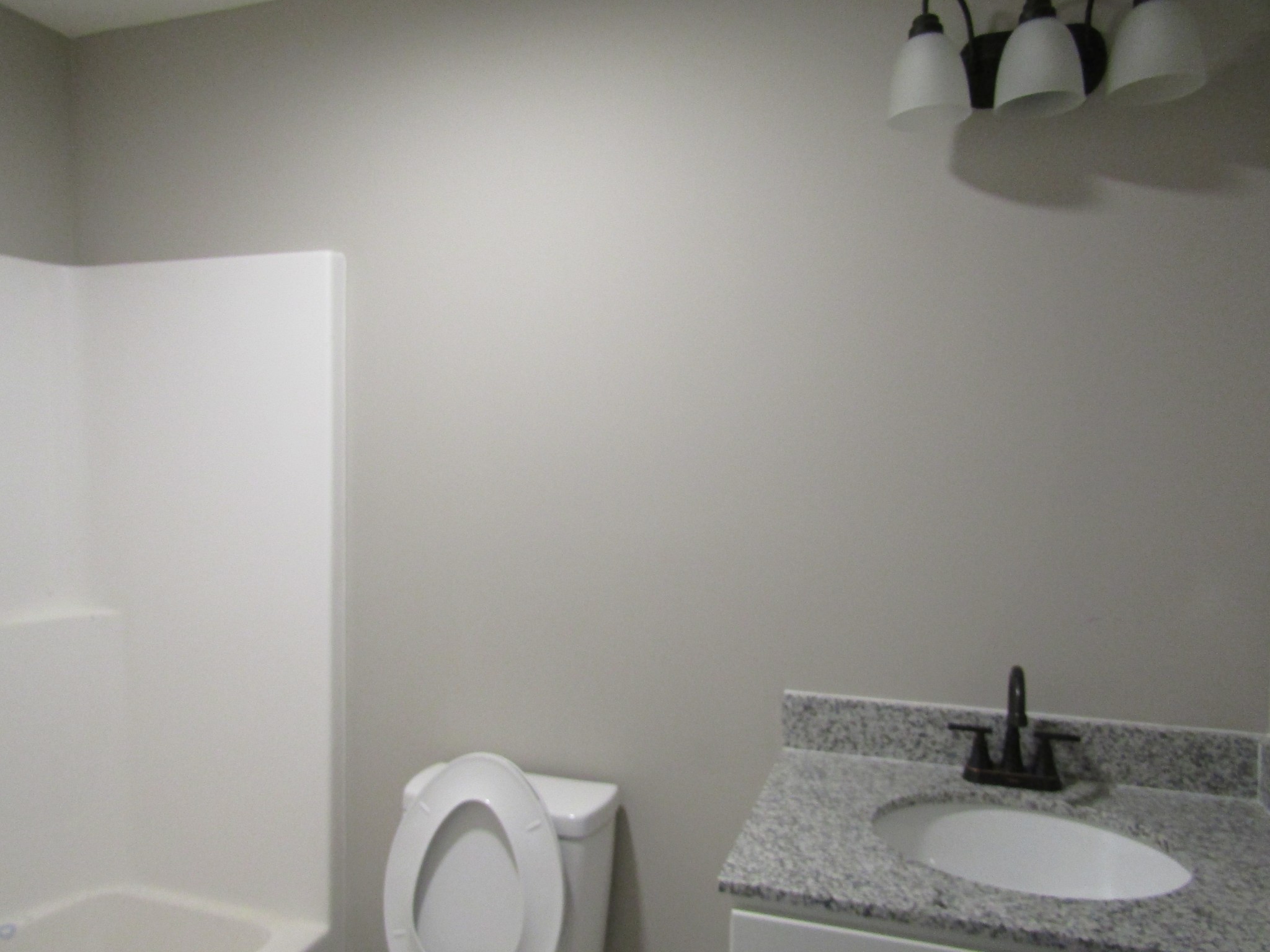 2337 Claude Fox Road Cornersville, TN 37047 - Photo 14 of 14 a bathroom with a granite countertop sink and a mirror
