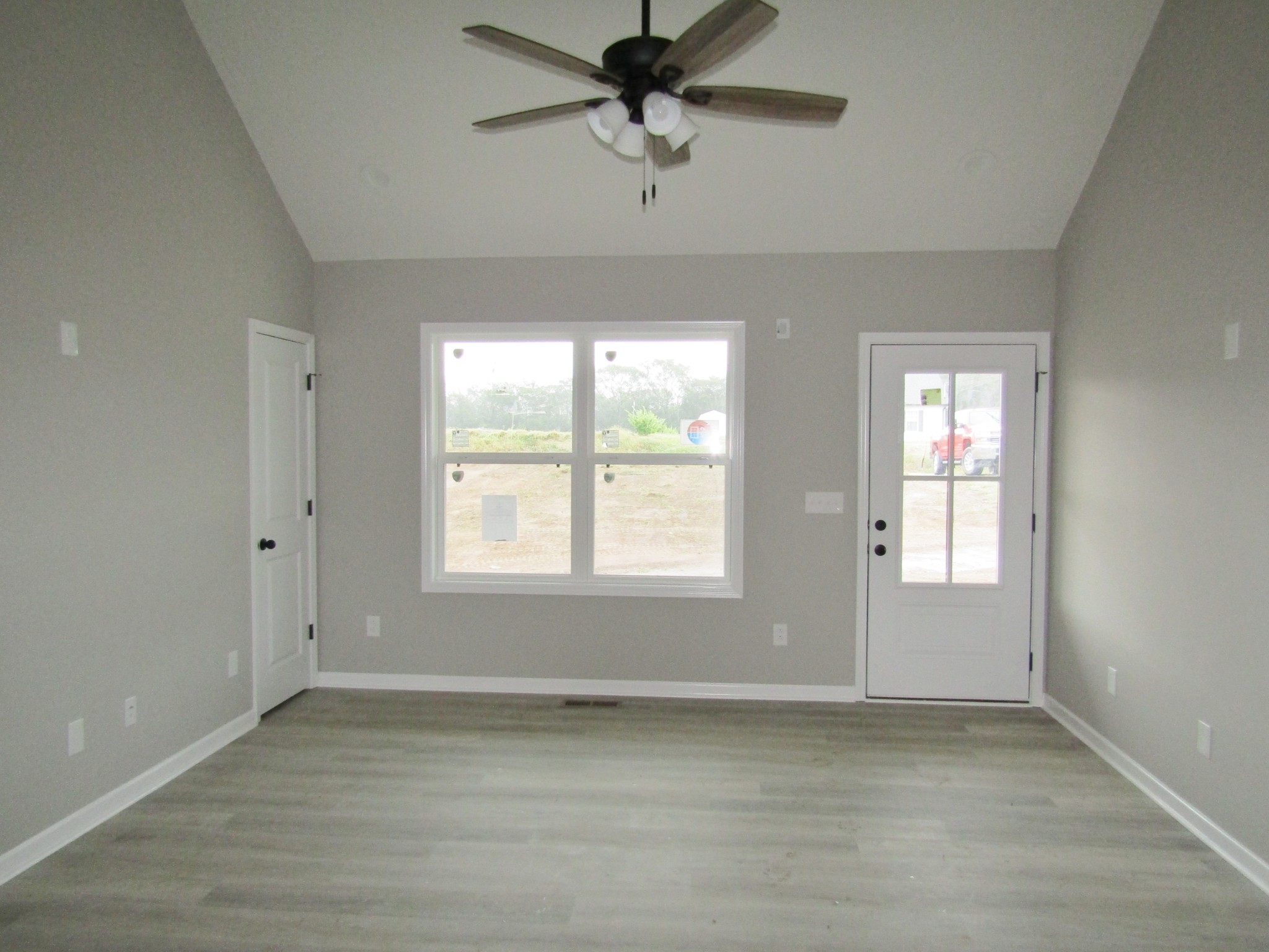 2337 Claude Fox Road Cornersville, TN 37047 - Photo 4 of 14 a view of a livingroom with a window a ceiling fan and wooden floor