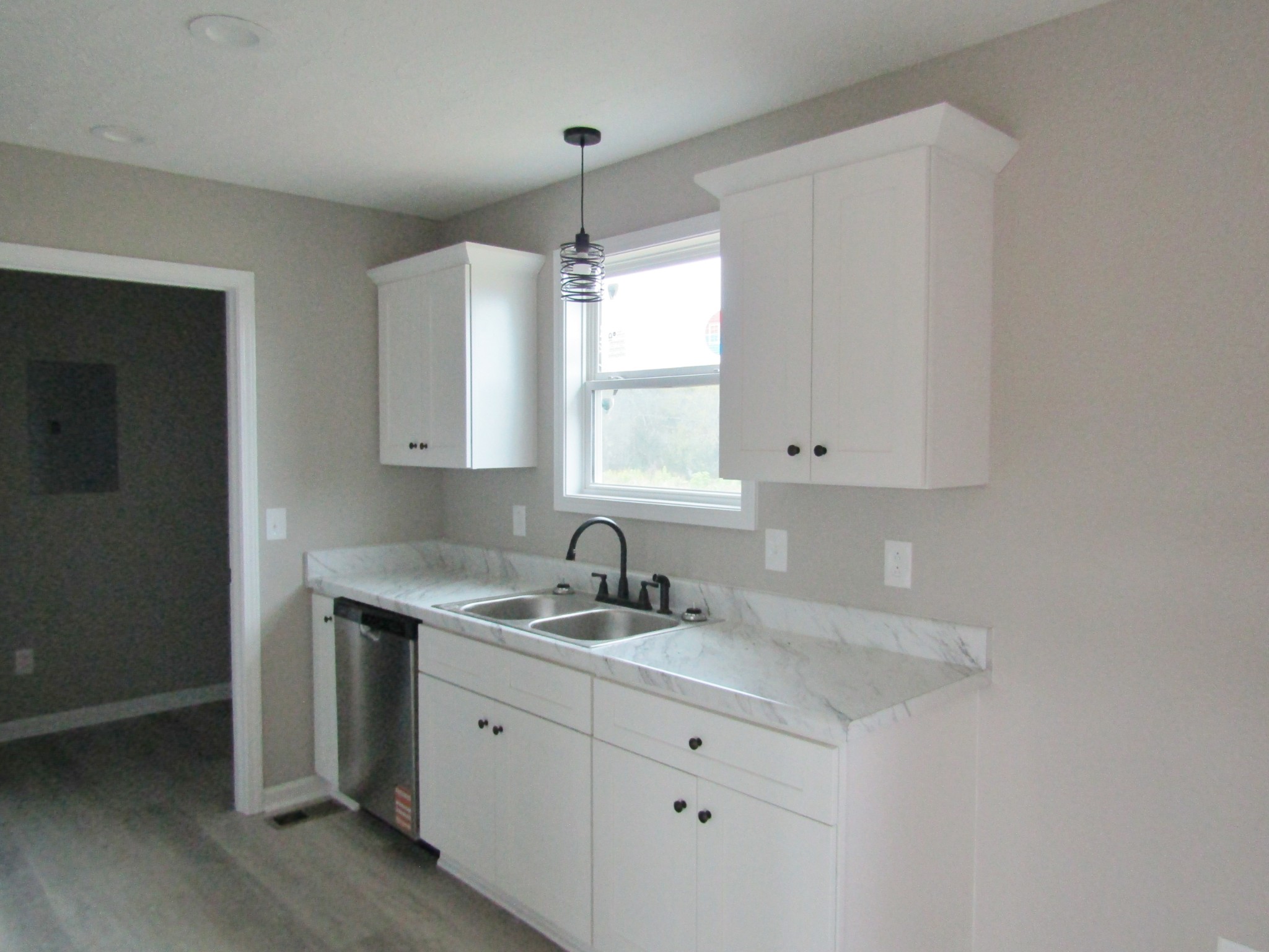 2337 Claude Fox Road Cornersville, TN 37047 - Photo 8 of 14 a kitchen with sink stove and cabinets