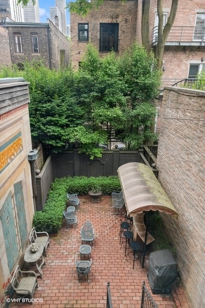 59 East Elm Street Chicago, IL 60611 - Photo 11 of 27 a wooden bench sitting in front of a building