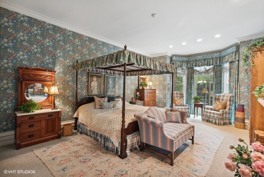 59 East Elm Street Chicago, IL 60611 - Photo 14 of 27 a bedroom with a large bed and a couch