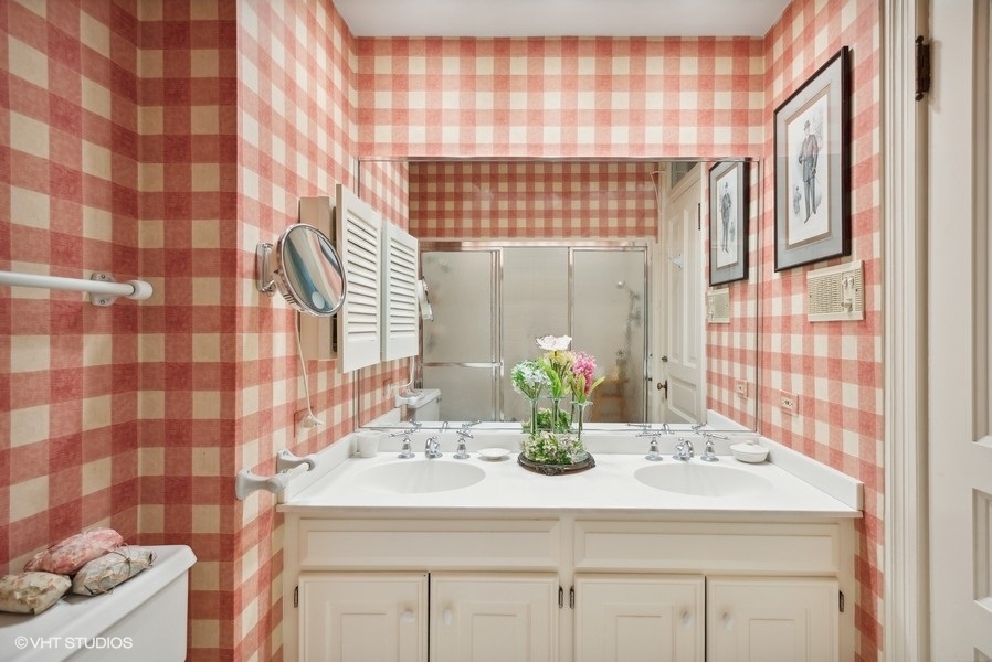 59 East Elm Street Chicago, IL 60611 - Photo 16 of 27 a bathroom with a sink and a mirror