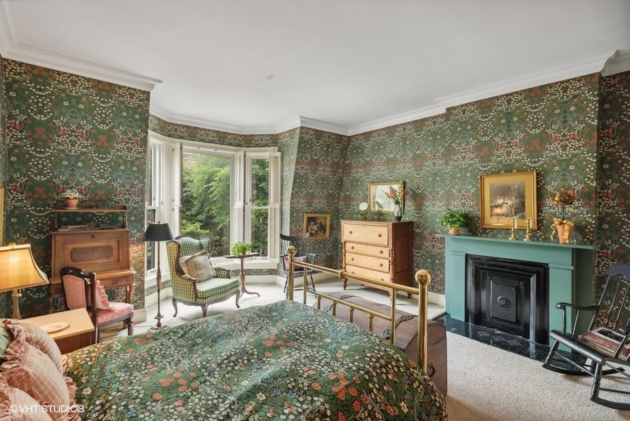 59 East Elm Street Chicago, IL 60611 - Photo 19 of 27 a living room with furniture and a fireplace