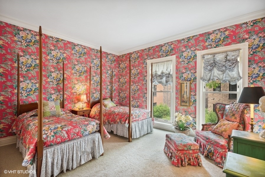 59 East Elm Street Chicago, IL 60611 - Photo 21 of 27 a spacious bedroom with a bed and a couch