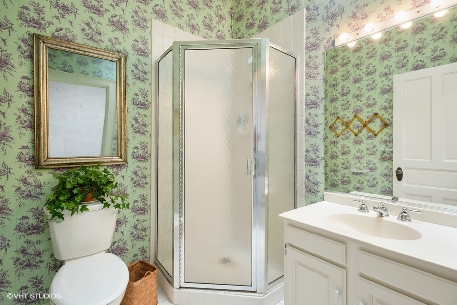 59 East Elm Street Chicago, IL 60611 - Photo 22 of 27 a bathroom with a sink toilet and shower