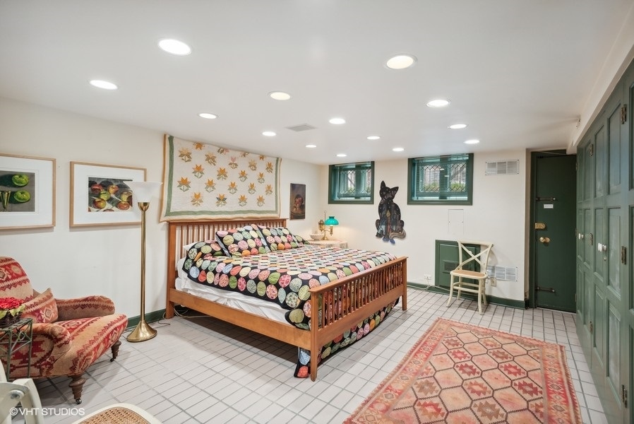 59 East Elm Street Chicago, IL 60611 - Photo 24 of 27 a bed room with a bed and furniture