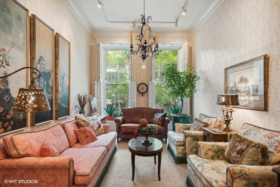 59 East Elm Street Chicago, IL 60611 - Photo 3 of 27 a living room with furniture and a chandelier