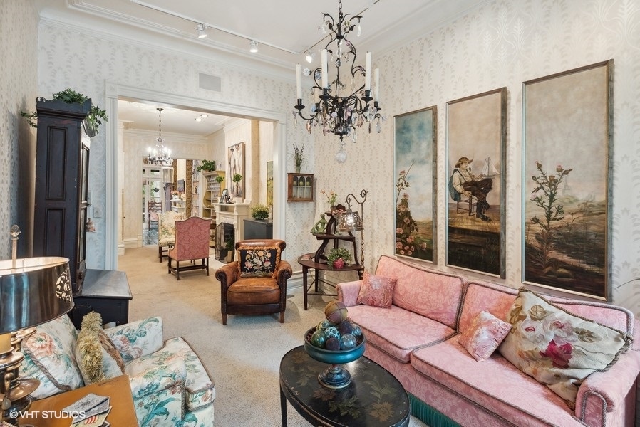 59 East Elm Street Chicago, IL 60611 - Photo 4 of 27 a living room with furniture and a chandelier