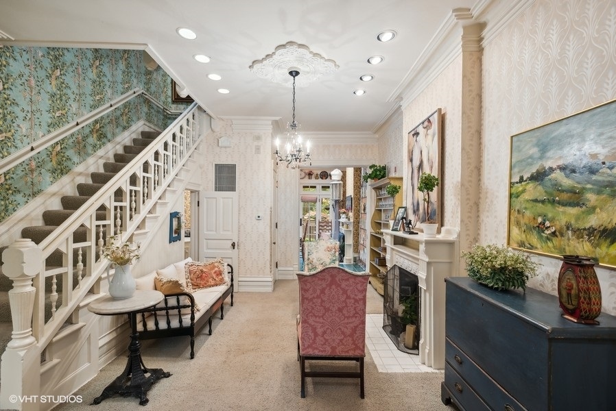 59 East Elm Street Chicago, IL 60611 - Photo 5 of 27 a living room with furniture and a chandelier