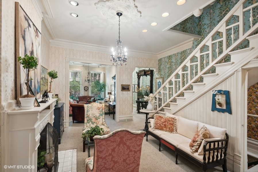 59 East Elm Street Chicago, IL 60611 - Photo 6 of 27 a living room with furniture and a chandelier