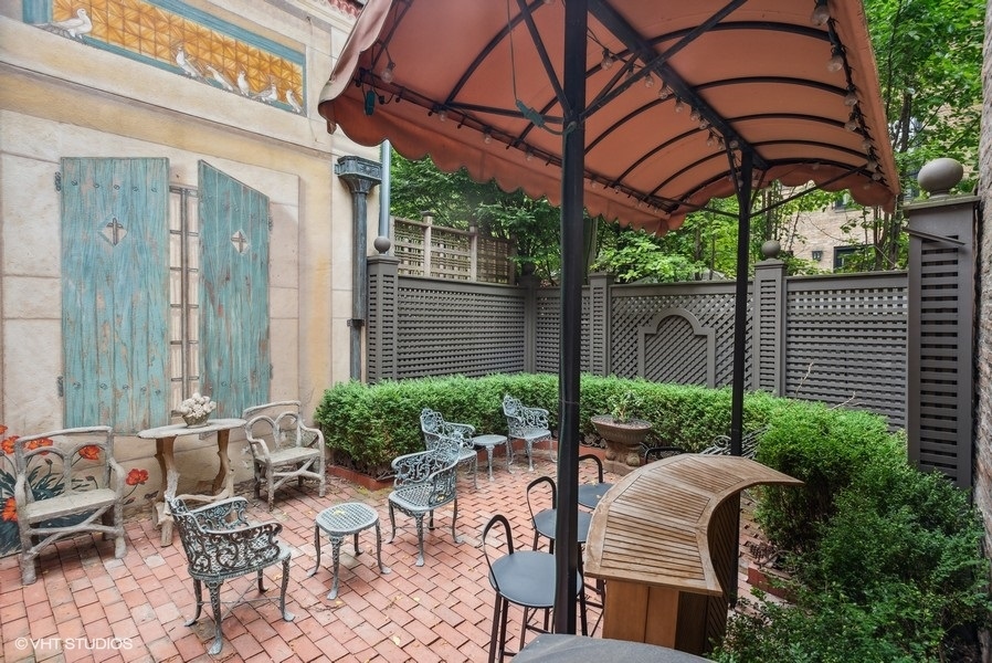 59 East Elm Street Chicago, IL 60611 - Photo 10 of 27 a view of backyard with outdoor seating and plants