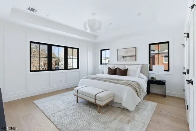 a spacious bedroom with a large bed and a window