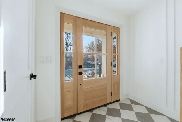 a view of a bathroom with a glass door shower and a sink
