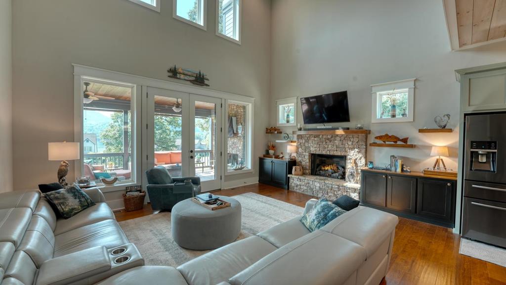 31 Elf School Road Hayesville, NC 28904 - Photo 25 of 59 a living room with furniture a flat screen tv and a fireplace