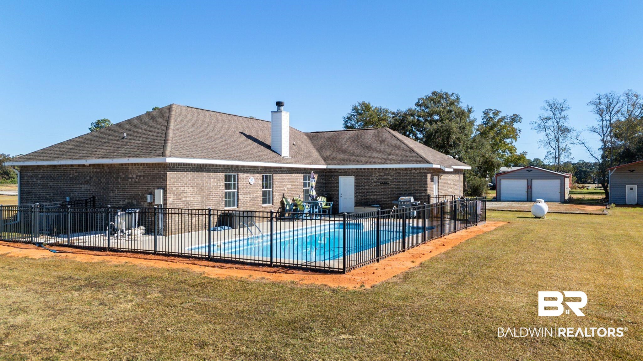 28980 Comstock Road Elberta, AL 36530 - Photo 26 of 38 Community pool featuring a patio, an outbuilding, and grilling area