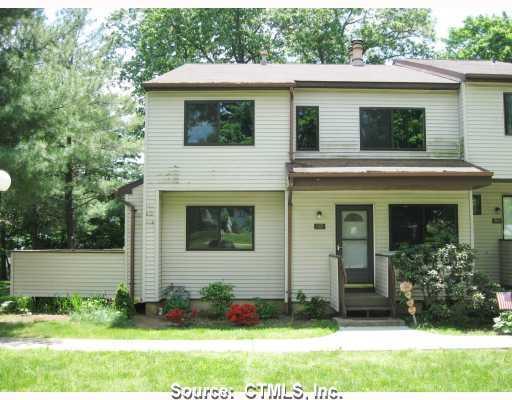 801 Cypress Road, Unit 801 Newington, CT 06111 - Photo 1 of 1 a front view of a house with a yard