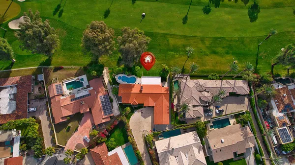 an aerial view of houses with outdoor space