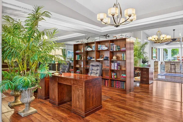 a dining room with furniture and wooden floor