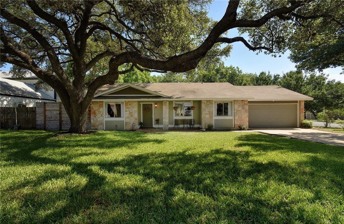 2300 Lear Lane Austin, TX 78745 - Photo 1 of 1 a front view of a house with a garden