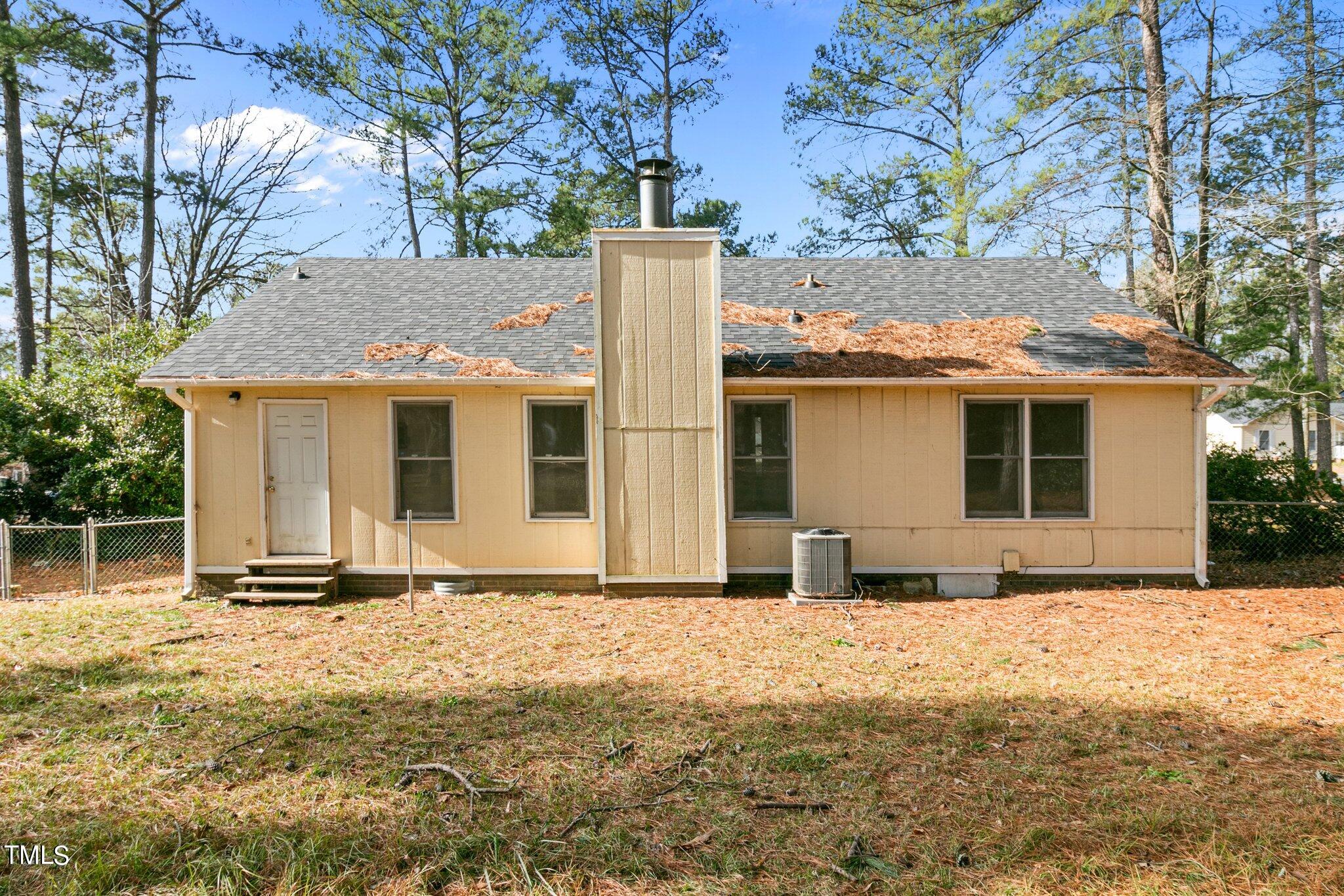 1775 Rim Road Fayetteville, NC 28314 - Photo 15 of 16 a front view of a house with a yard