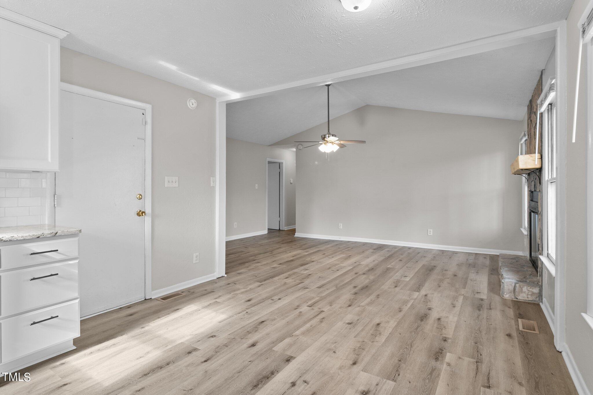 1775 Rim Road Fayetteville, NC 28314 - Photo 7 of 16 wooden floor in an empty room with a window