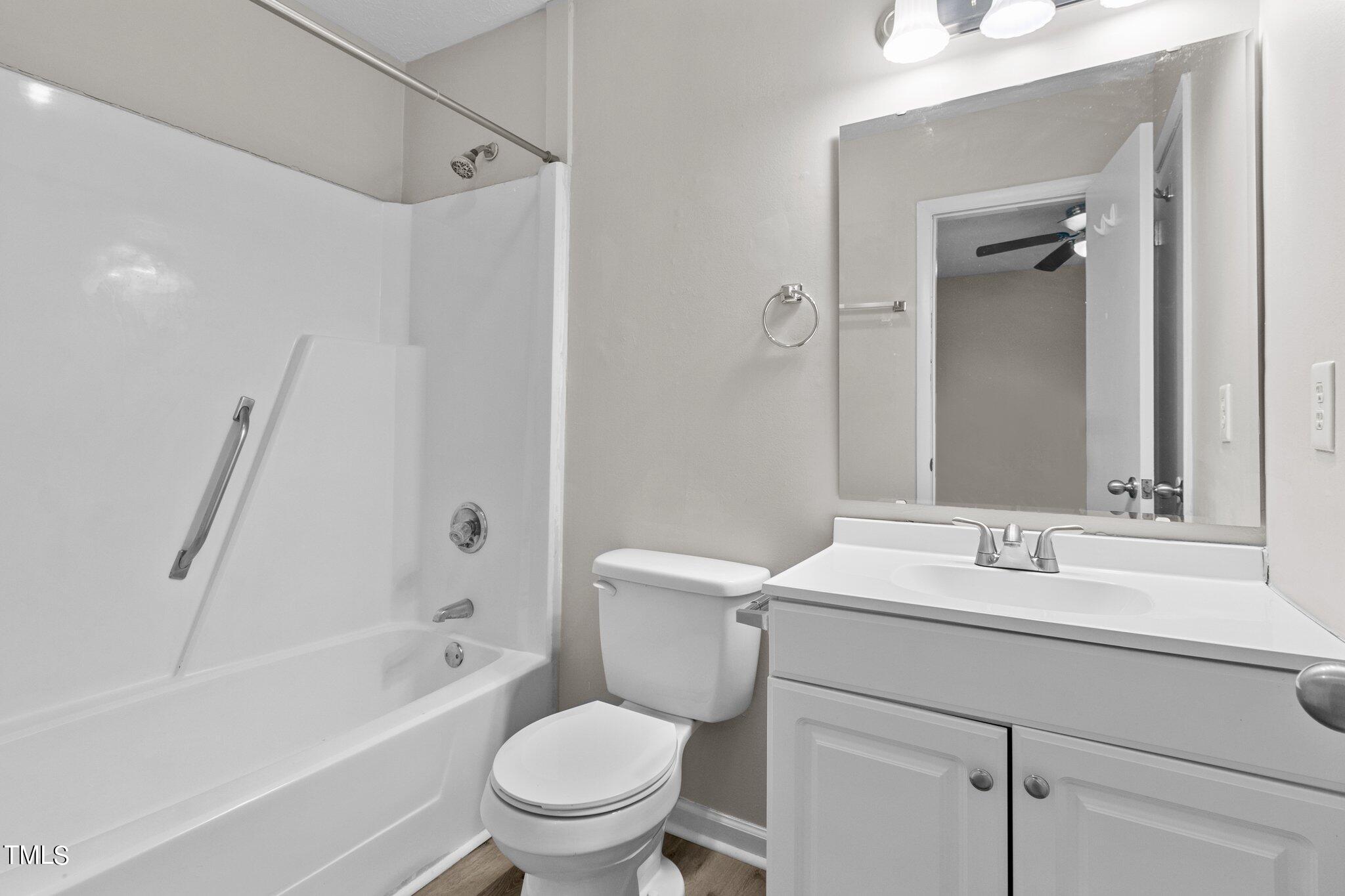 1775 Rim Road Fayetteville, NC 28314 - Photo 8 of 16 a bathroom with a sink toilet vanity and shower