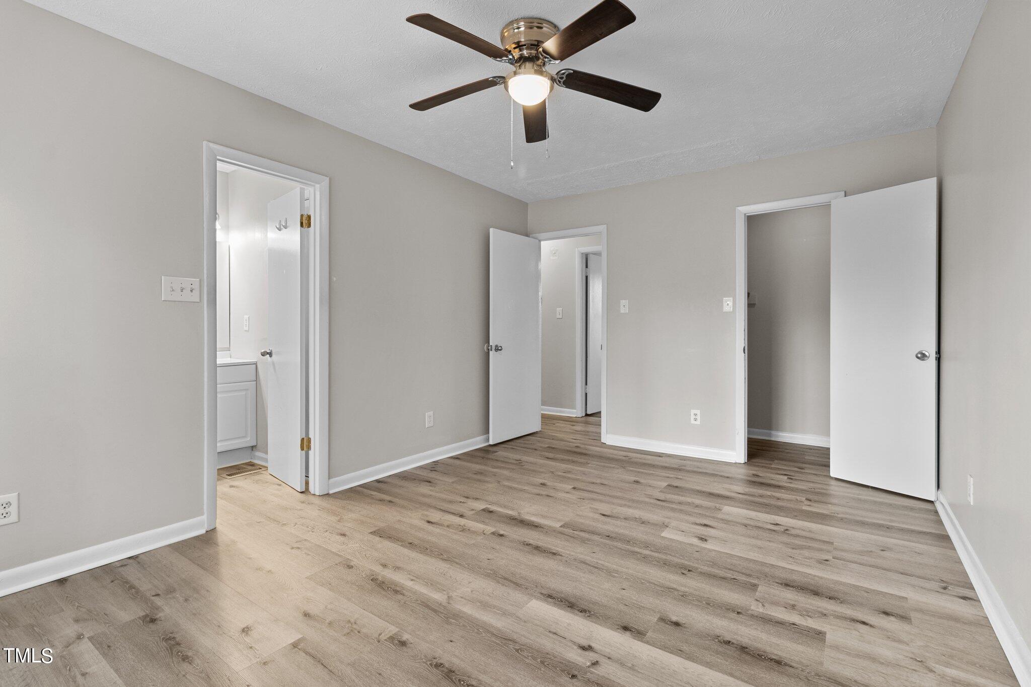 1775 Rim Road Fayetteville, NC 28314 - Photo 10 of 16 a view of an empty room and wooden floor