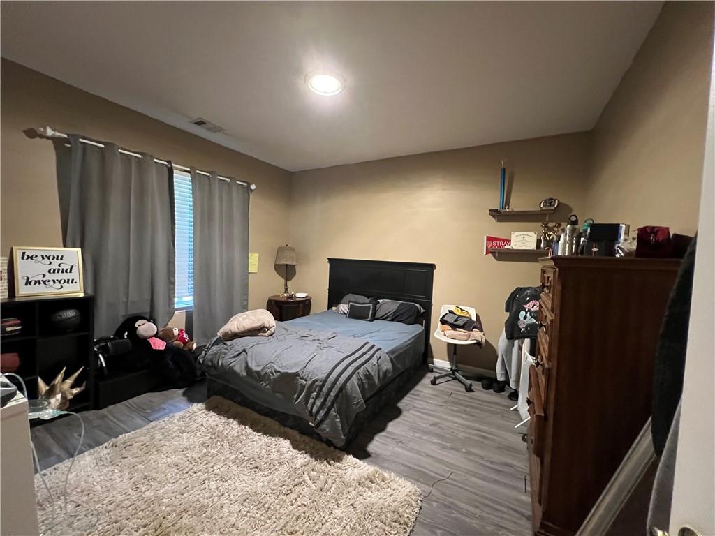 3914 Howell Park Road Duluth, GA 30096 - Photo 23 of 33 a bedroom with a bed and dresser
