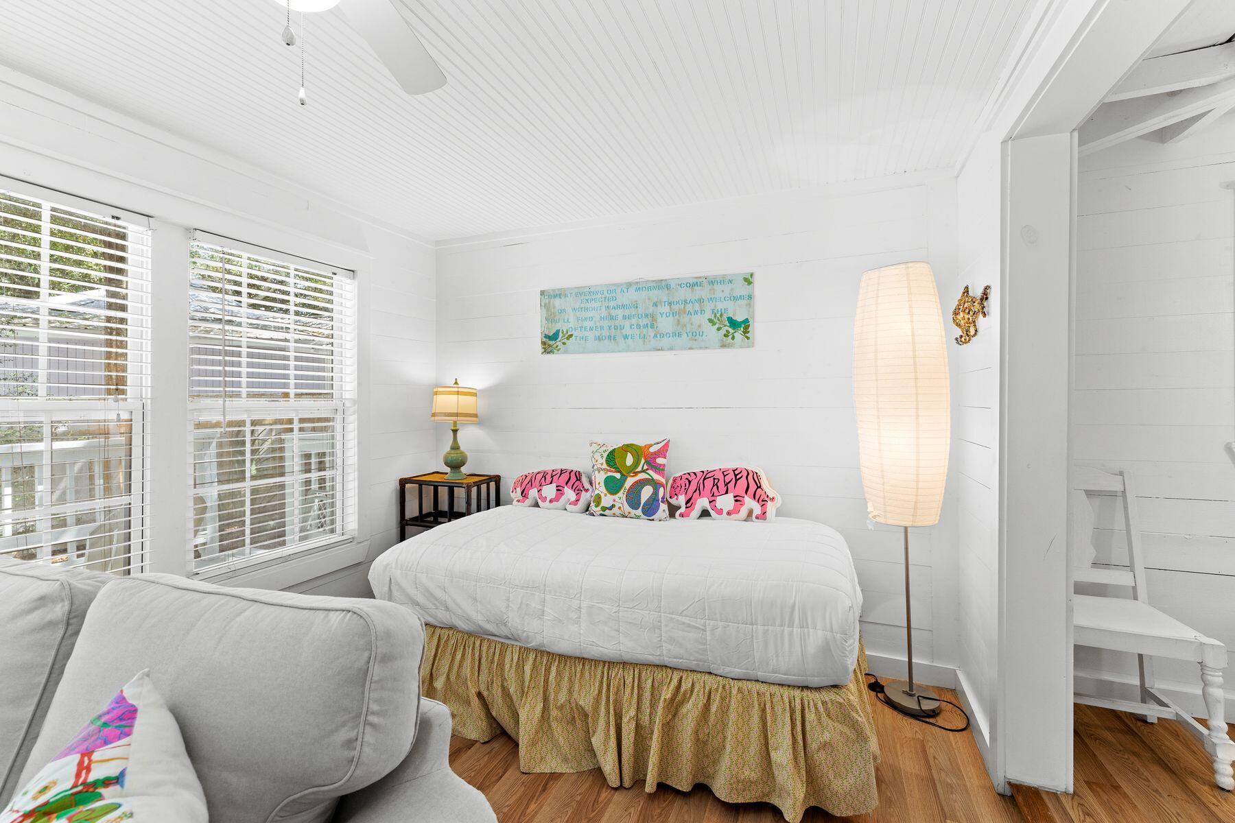 147 Magnolia Street Santa Rosa Beach, FL 32459 - Photo 11 of 33 a bedroom with a bed and a window
