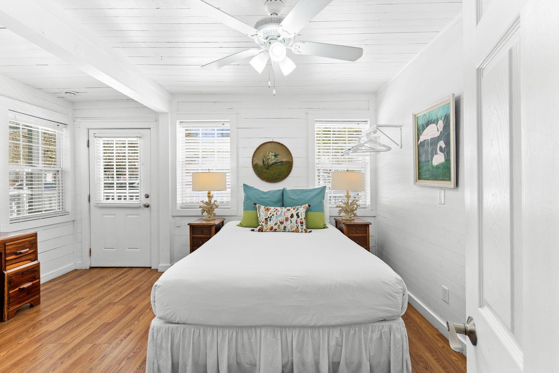 147 Magnolia Street Santa Rosa Beach, FL 32459 - Photo 19 of 33 a bedroom with a bed mirror and window