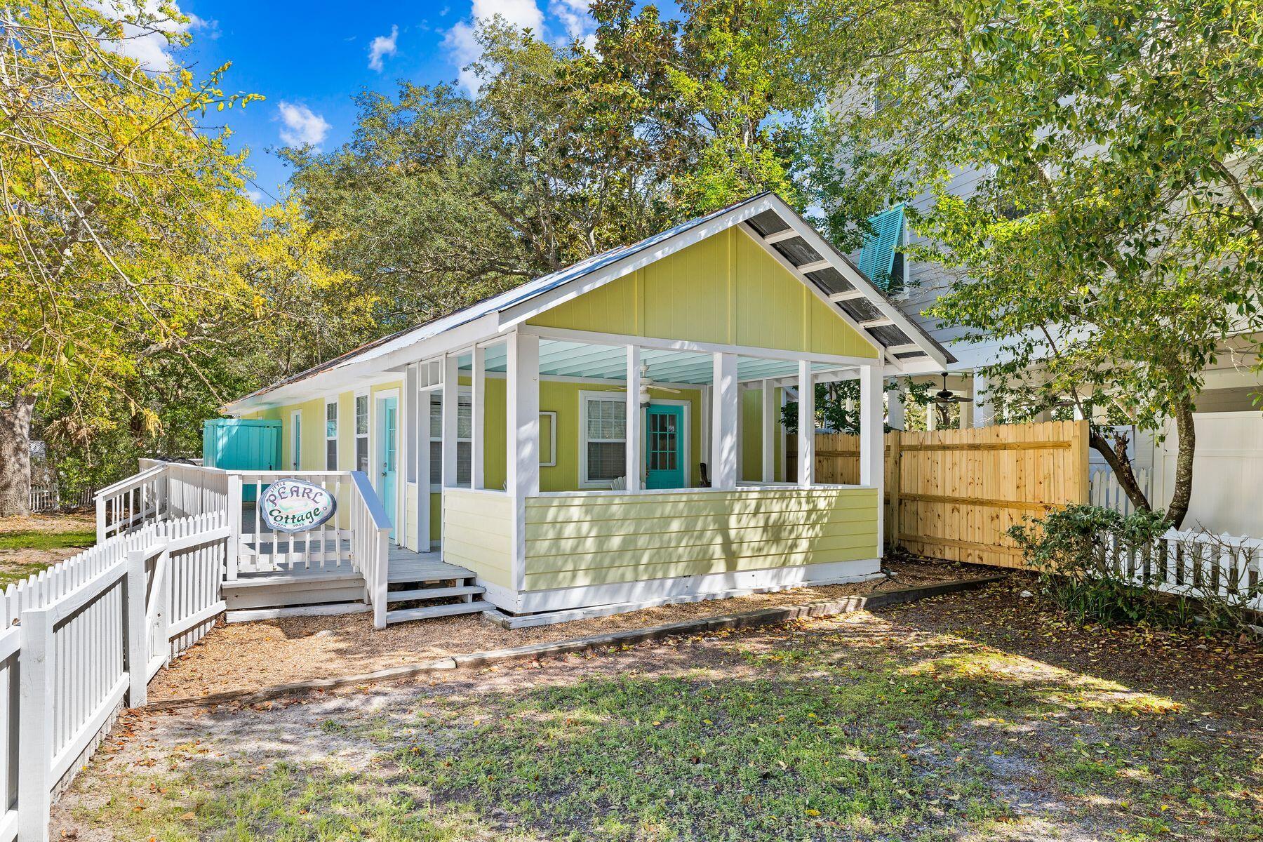 147 Magnolia Street Santa Rosa Beach, FL 32459 - Photo 25 of 33 a view of a house with a yard