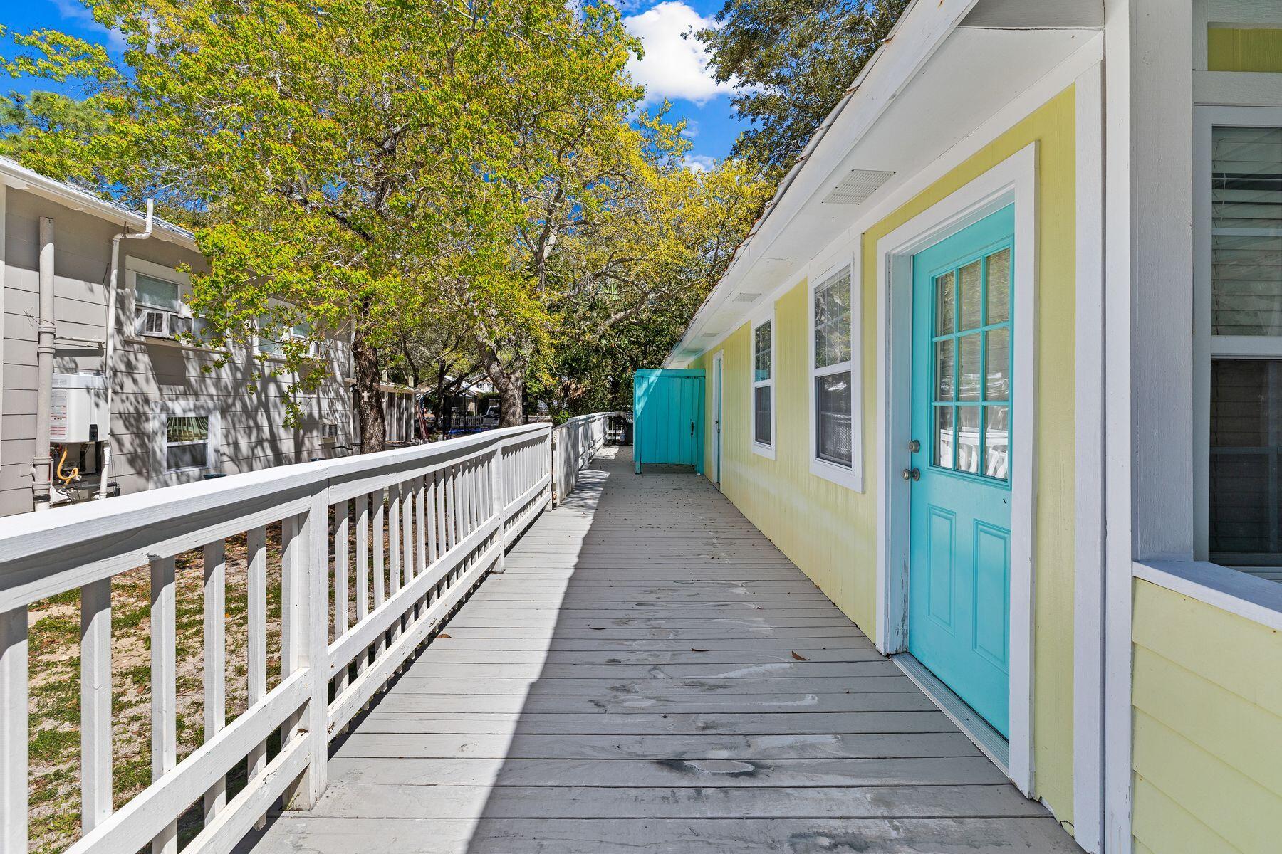 147 Magnolia Street Santa Rosa Beach, FL 32459 - Photo 30 of 33 a view of a balcony with wooden floor