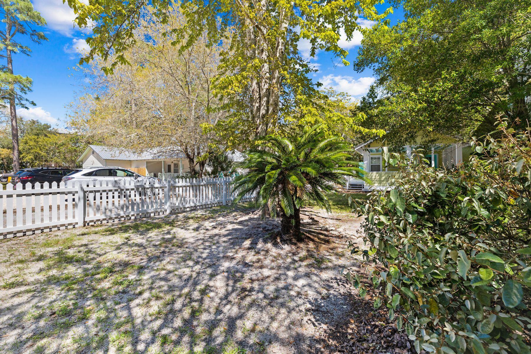 147 Magnolia Street Santa Rosa Beach, FL 32459 - Photo 33 of 33 a view of a yard with plants and trees