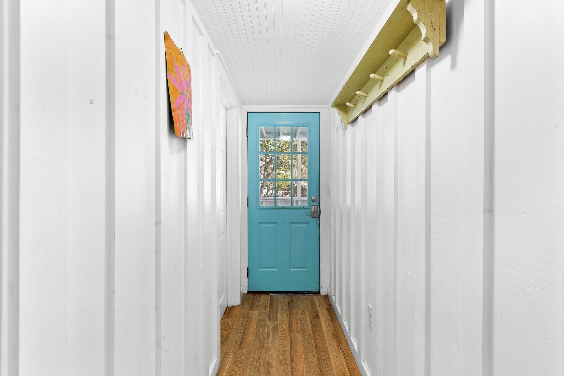 147 Magnolia Street Santa Rosa Beach, FL 32459 - Photo 8 of 33 a view of a hallway with wooden floor and entryway