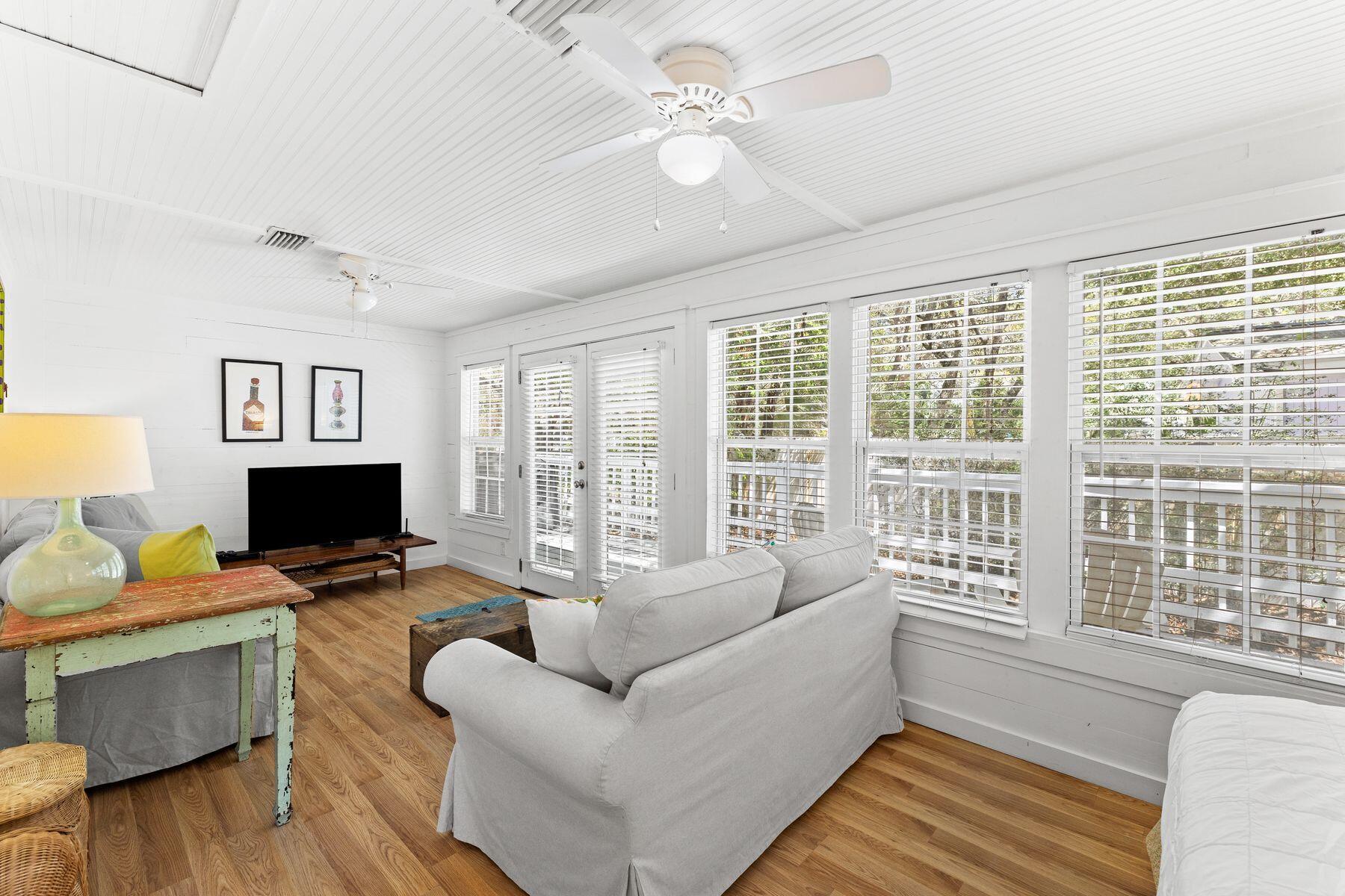 147 Magnolia Street Santa Rosa Beach, FL 32459 - Photo 10 of 33 a living room with furniture flat screen tv and a window