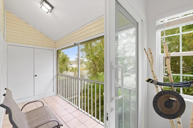 a bed room with a bed and a large window