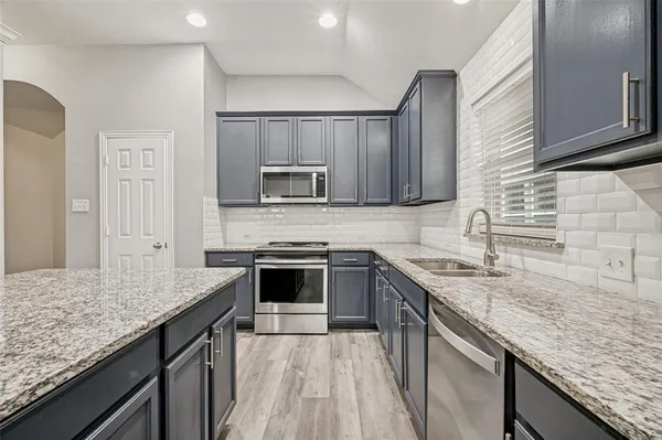a view of a livingroom with wooden floor