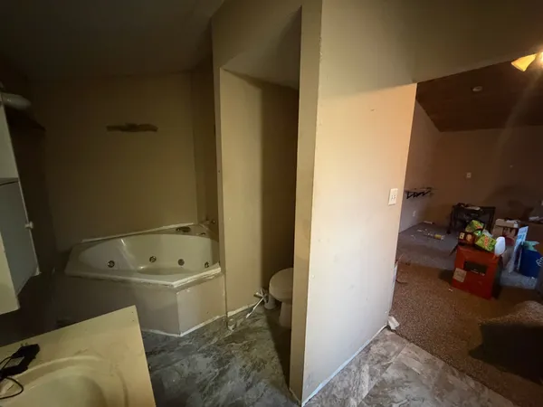 a bathroom with a sink a toilet and tub