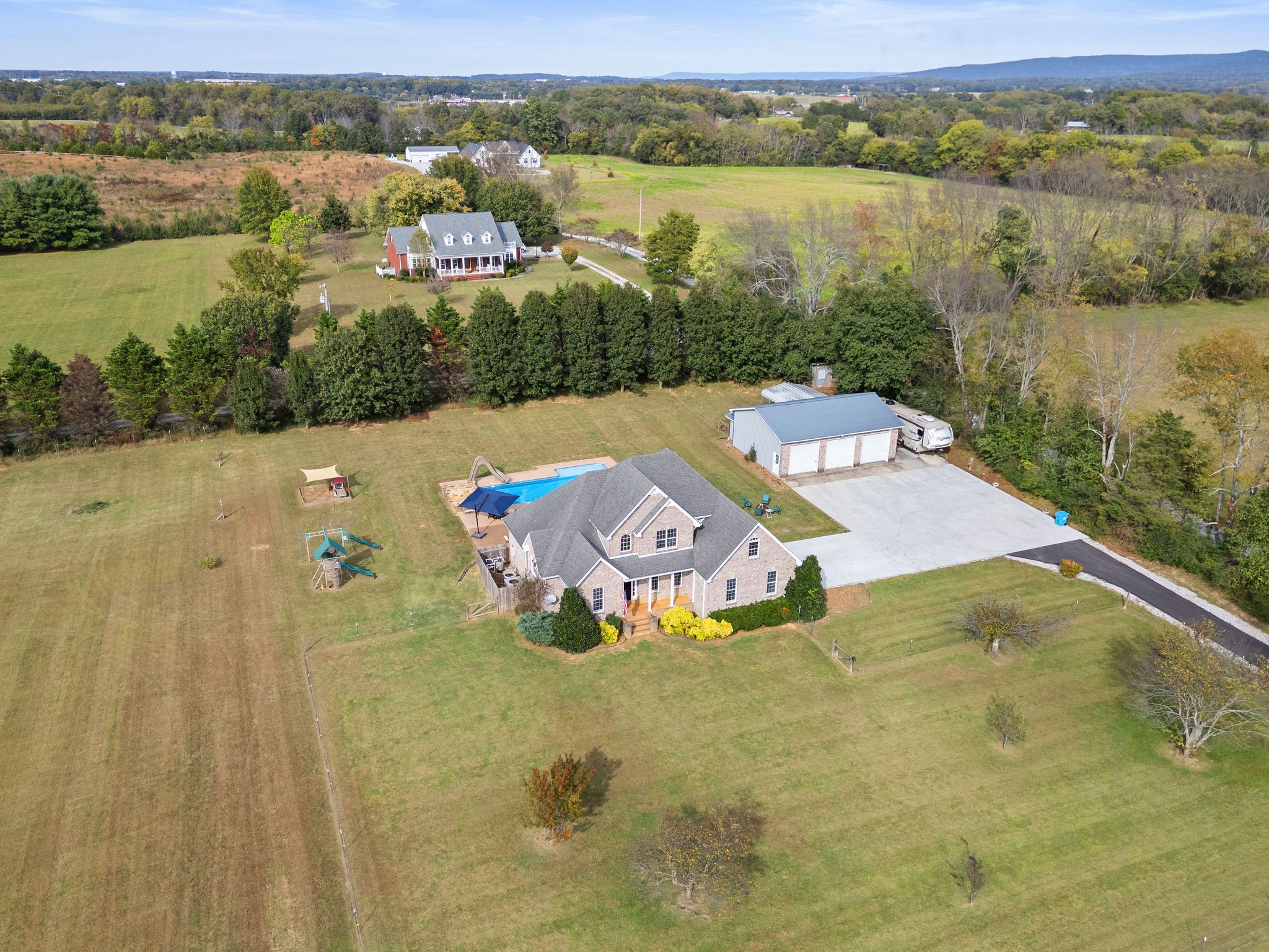 an aerial view of a house with a lake view
