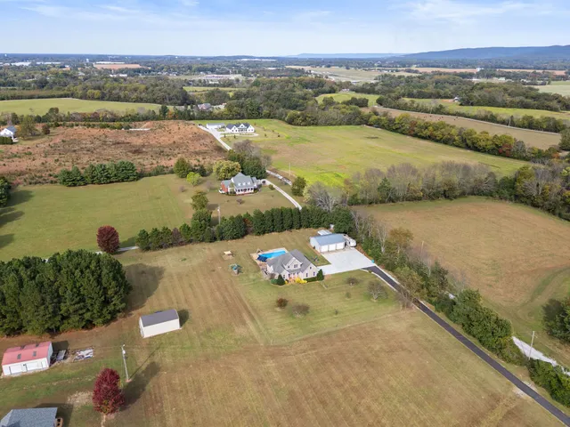 a view of a swimming pool with a yard