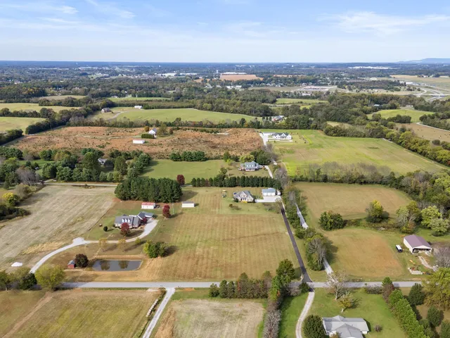 an aerial view of house with yard swimming pool and outdoor seating
