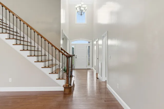 an empty room with closet and a ceiling fan