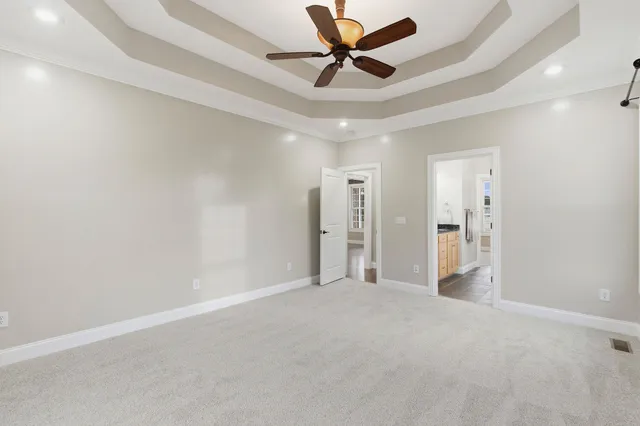 a view of a patio with table and chairs under an umbrella