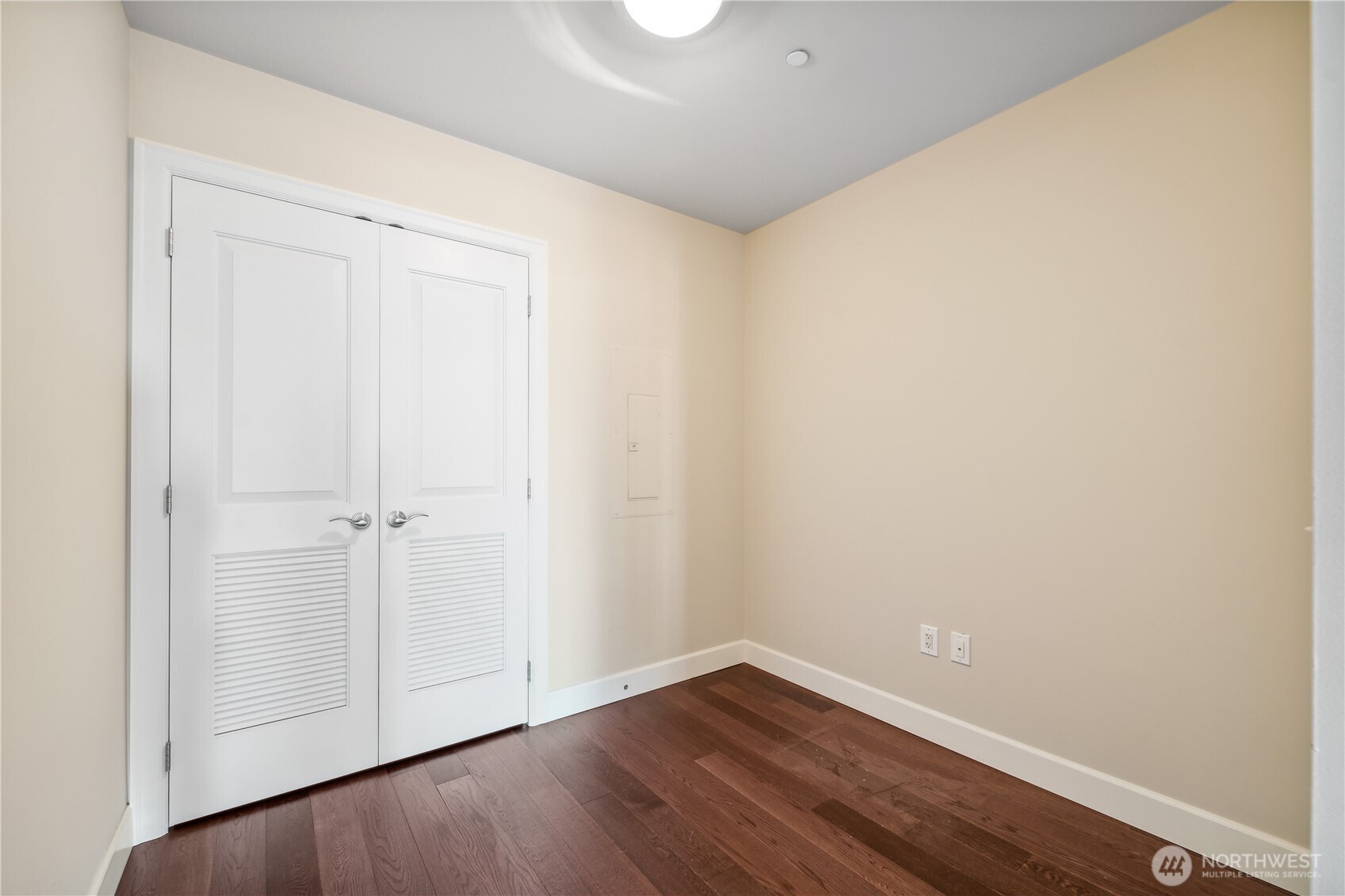 1920 4th Avenue, Unit 2301 Seattle, WA 98101 - Photo 13 of 40 a view of an empty room with wooden floor