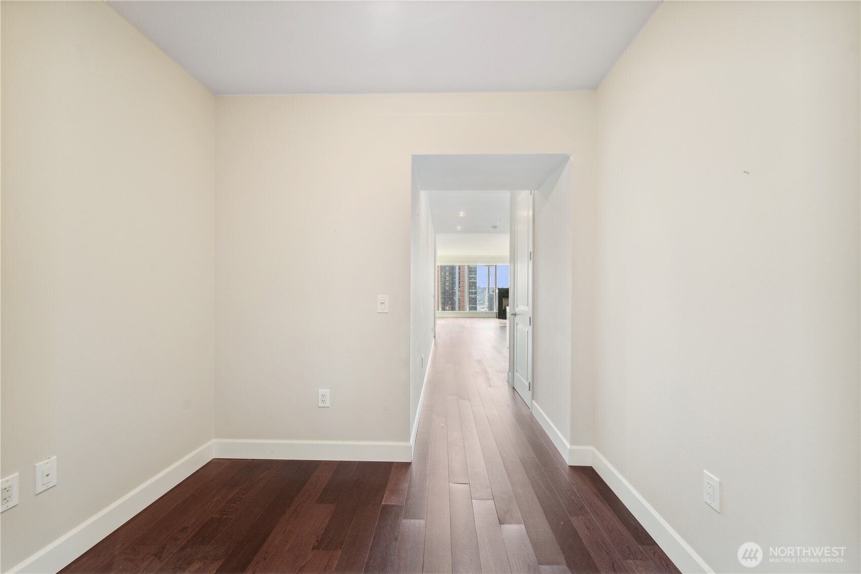 1920 4th Avenue, Unit 2301 Seattle, WA 98101 - Photo 14 of 40 a view of a room with wooden floor